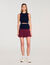 Short two-tone pleated skirt