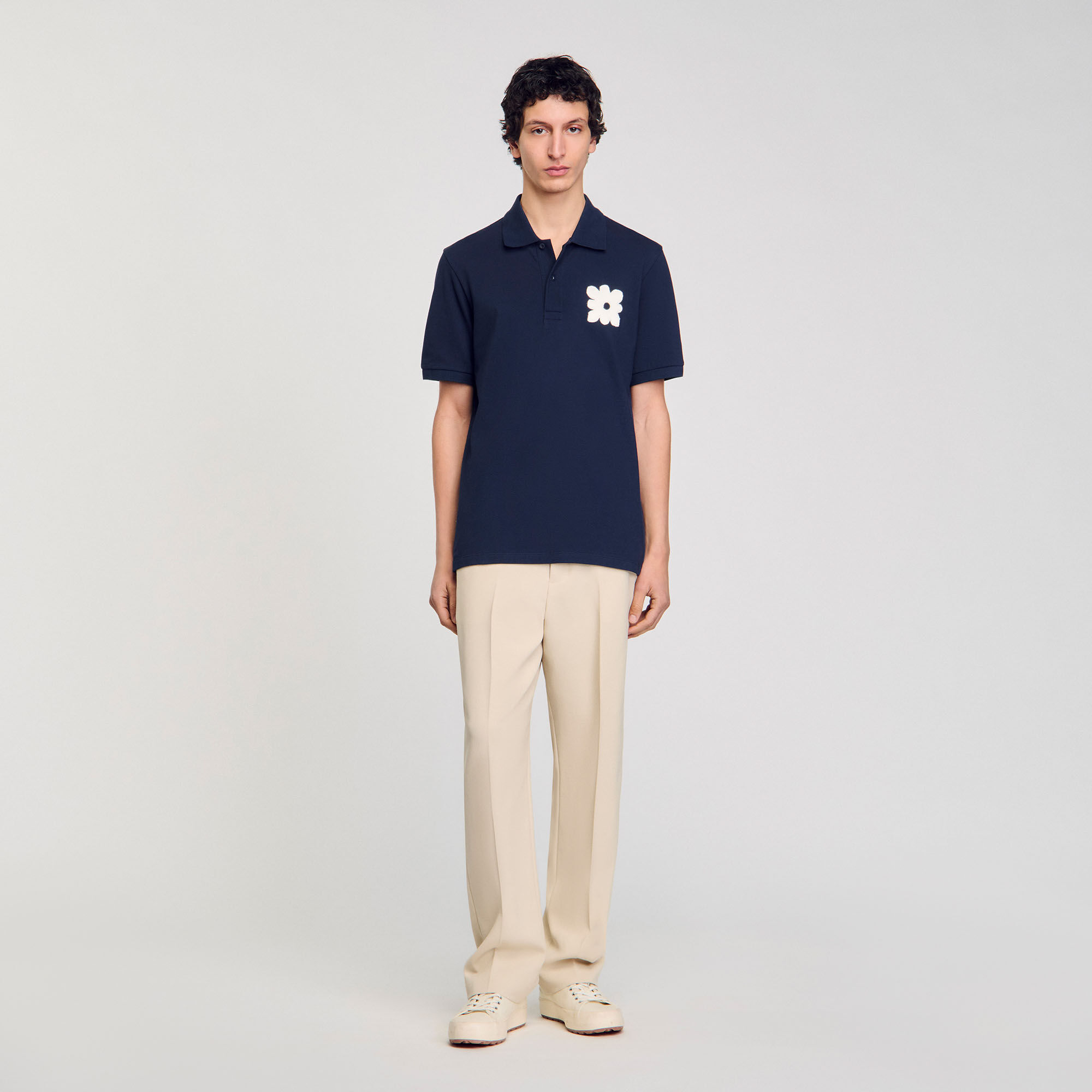 Polo shirt with flower patch