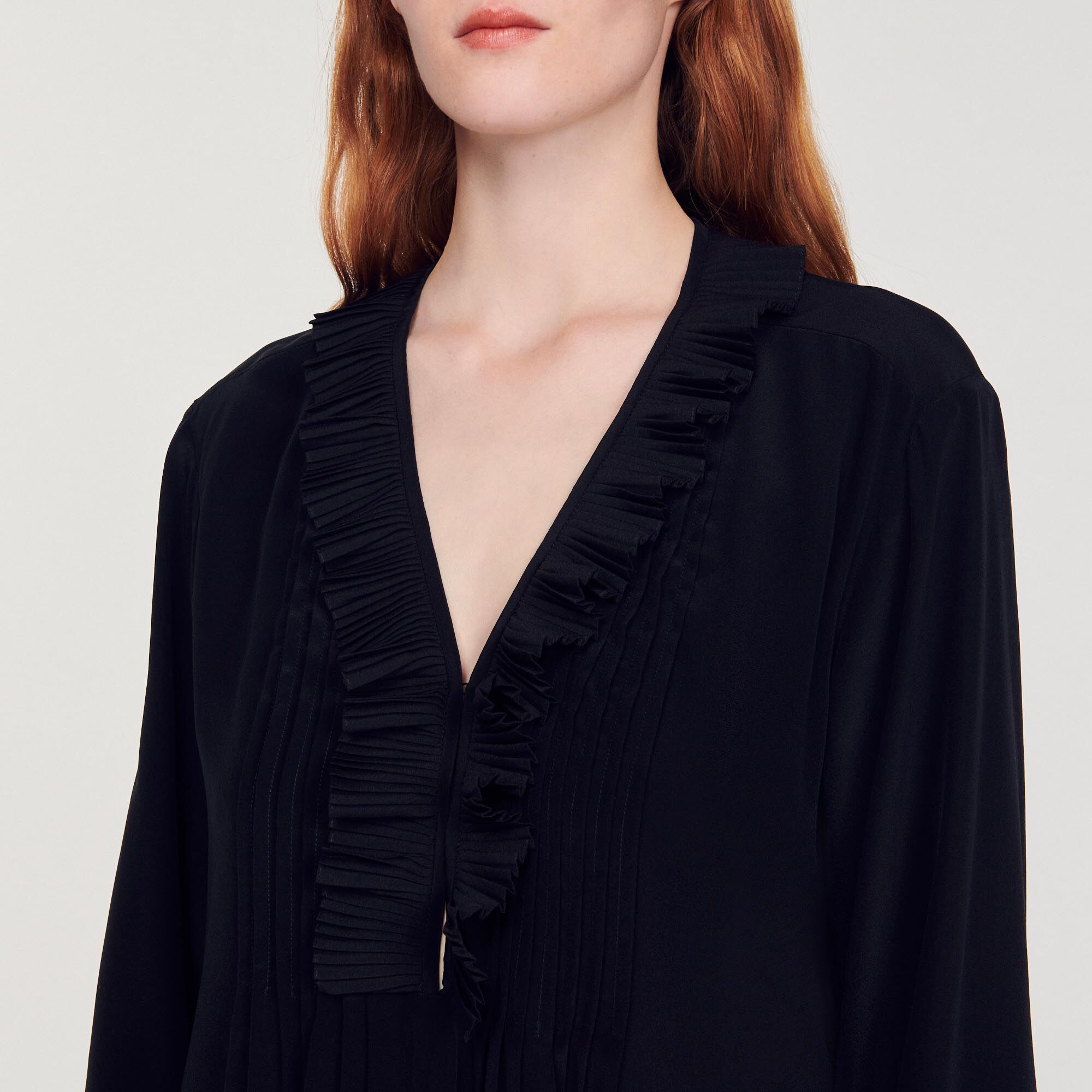Silk top with pleat edged neckline