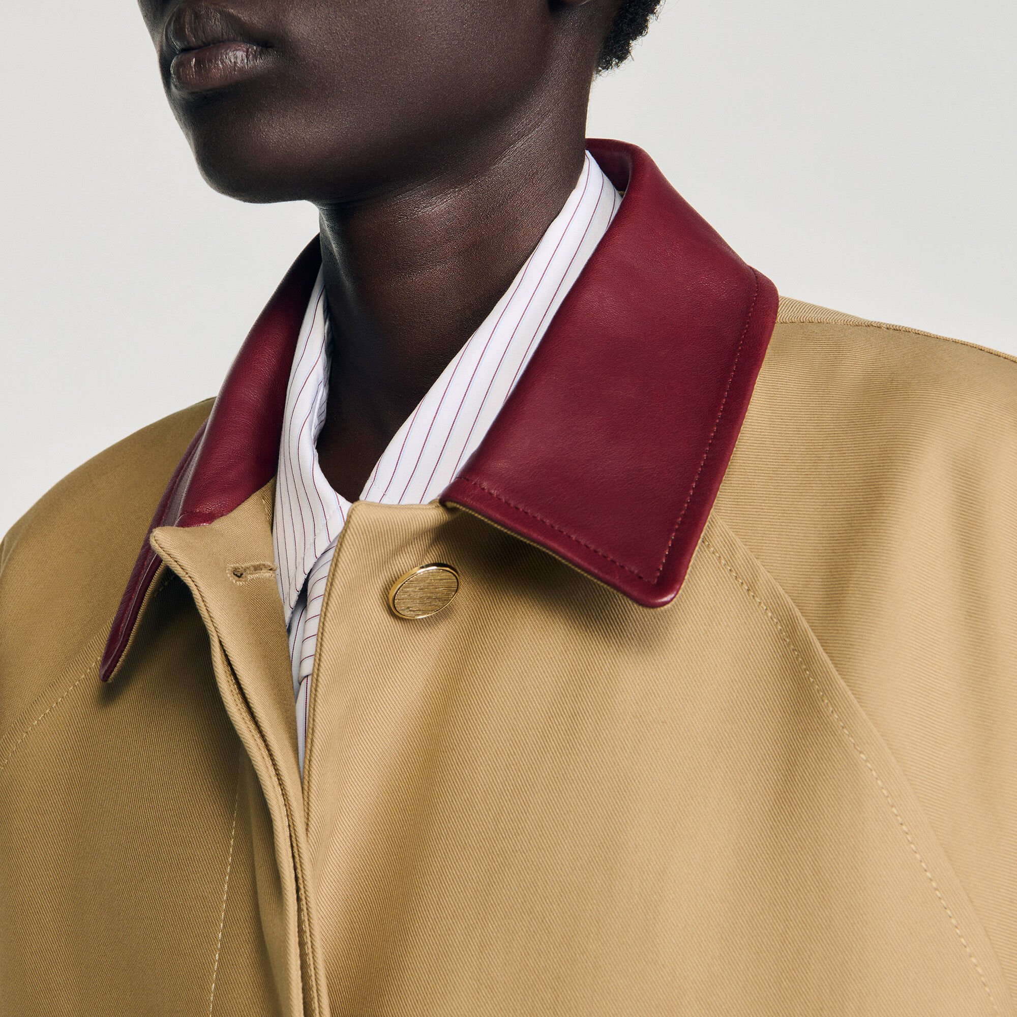 Trench coat with leather collar