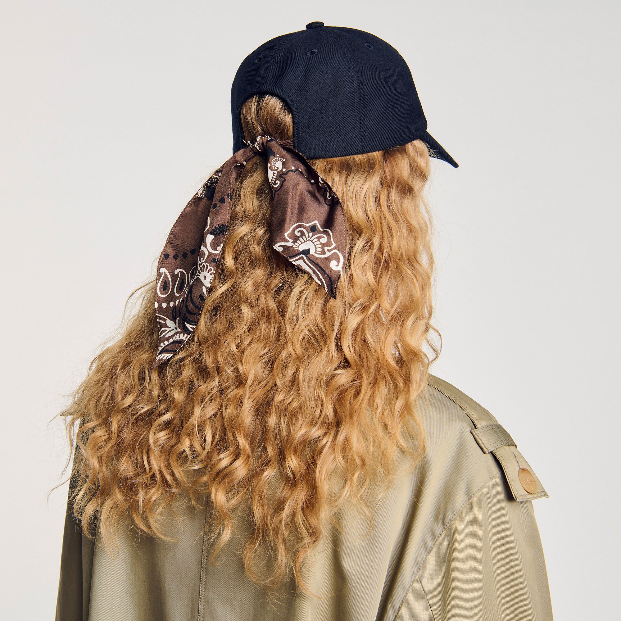 Cap with tied scarf