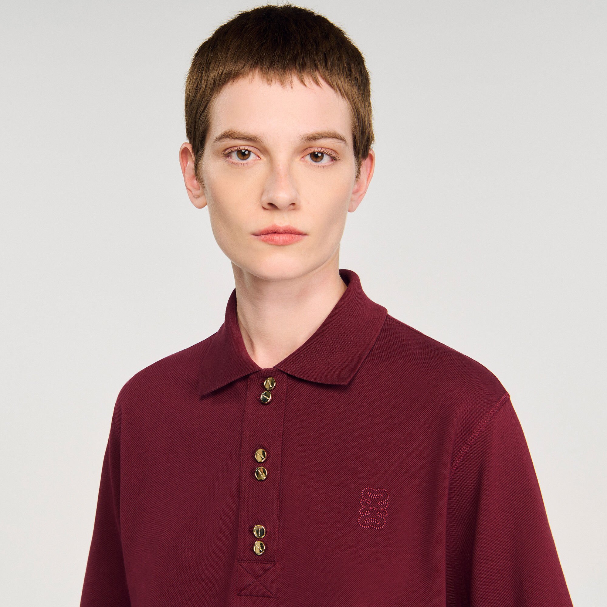 Polo shirt with decorative buttons