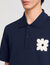 Polo shirt with flower patch