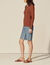 Sweater with twist and ring at the back