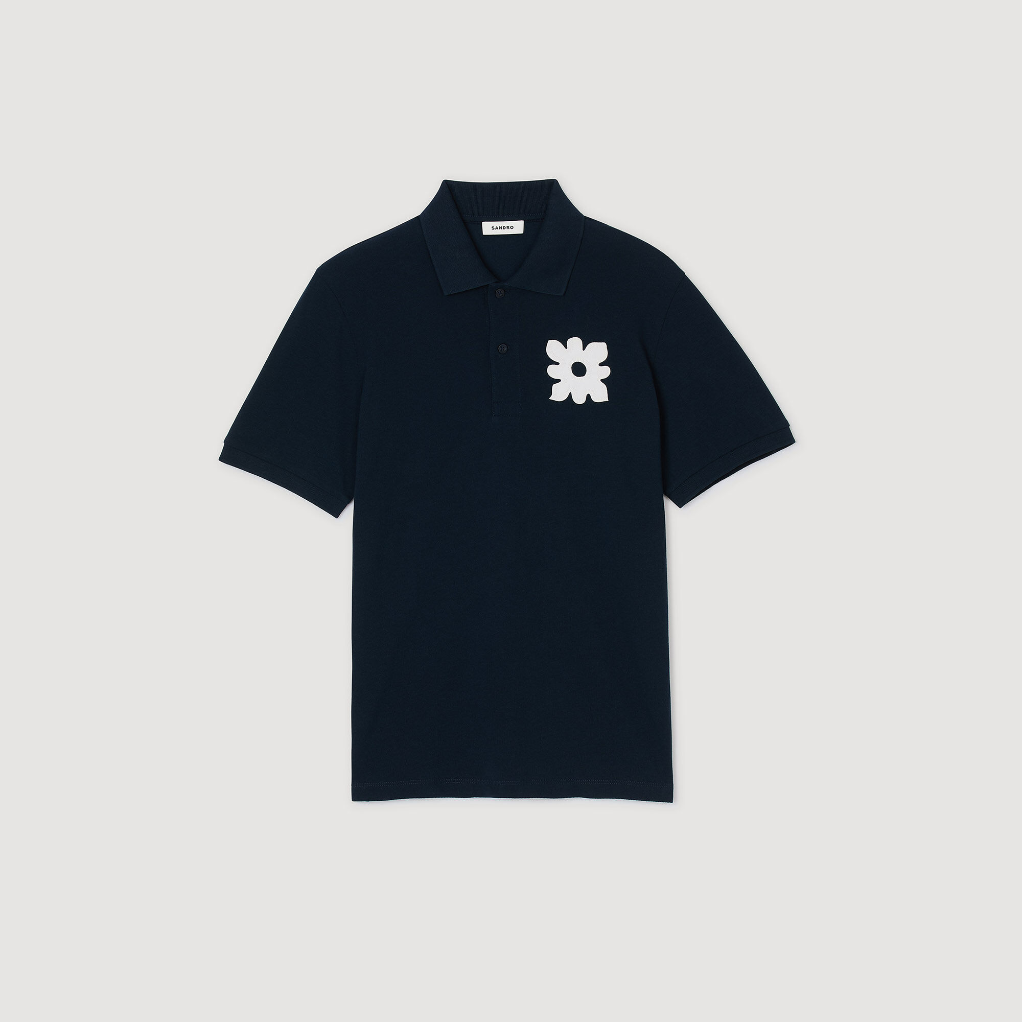 Polo shirt with flower patch