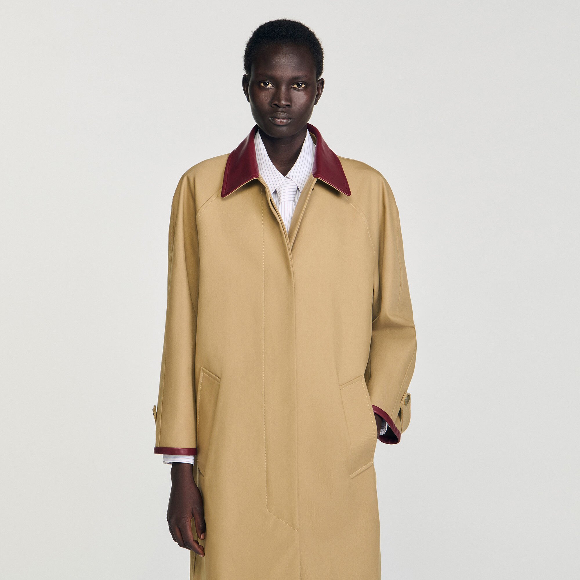 Trench coat with leather collar