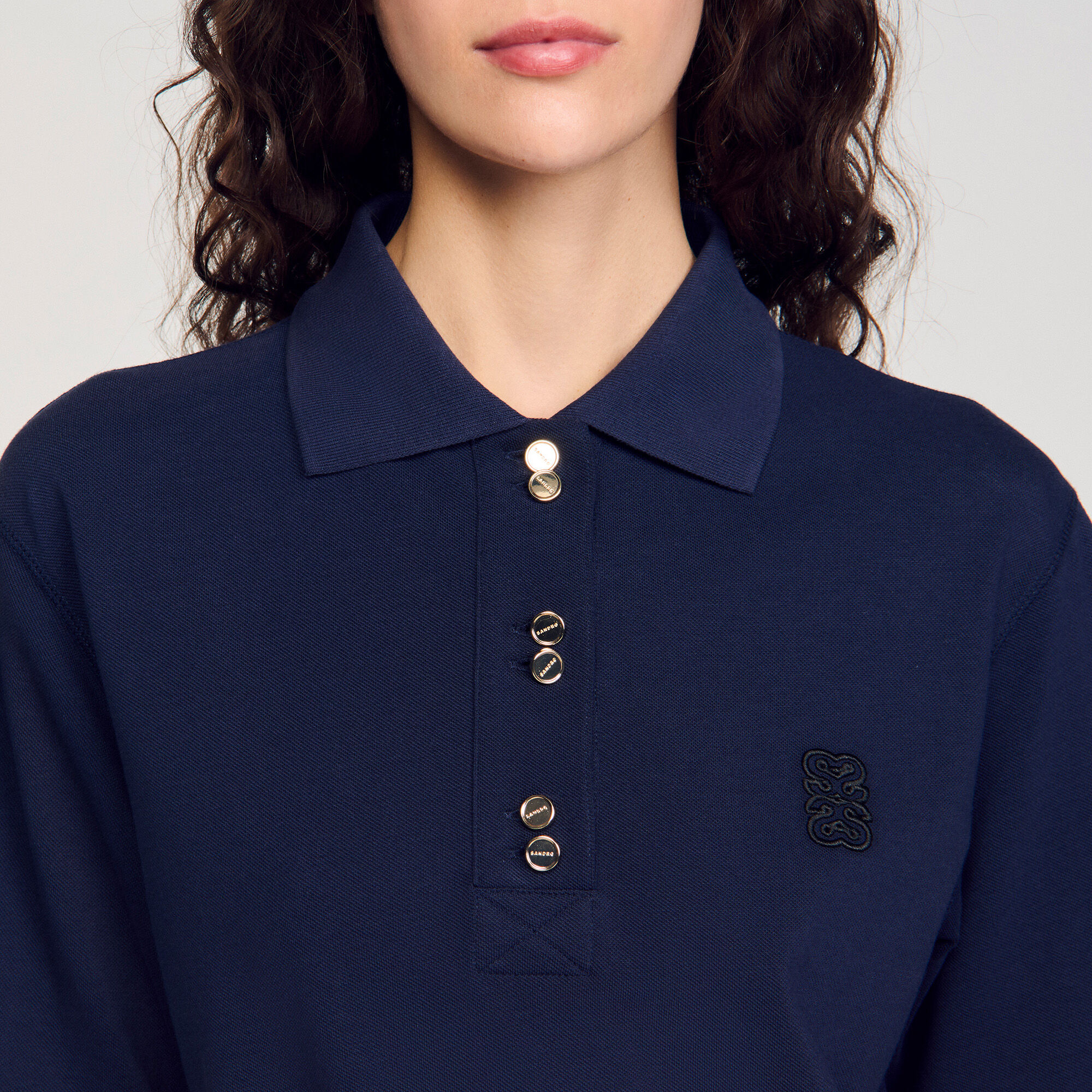 Polo shirt with decorative buttons