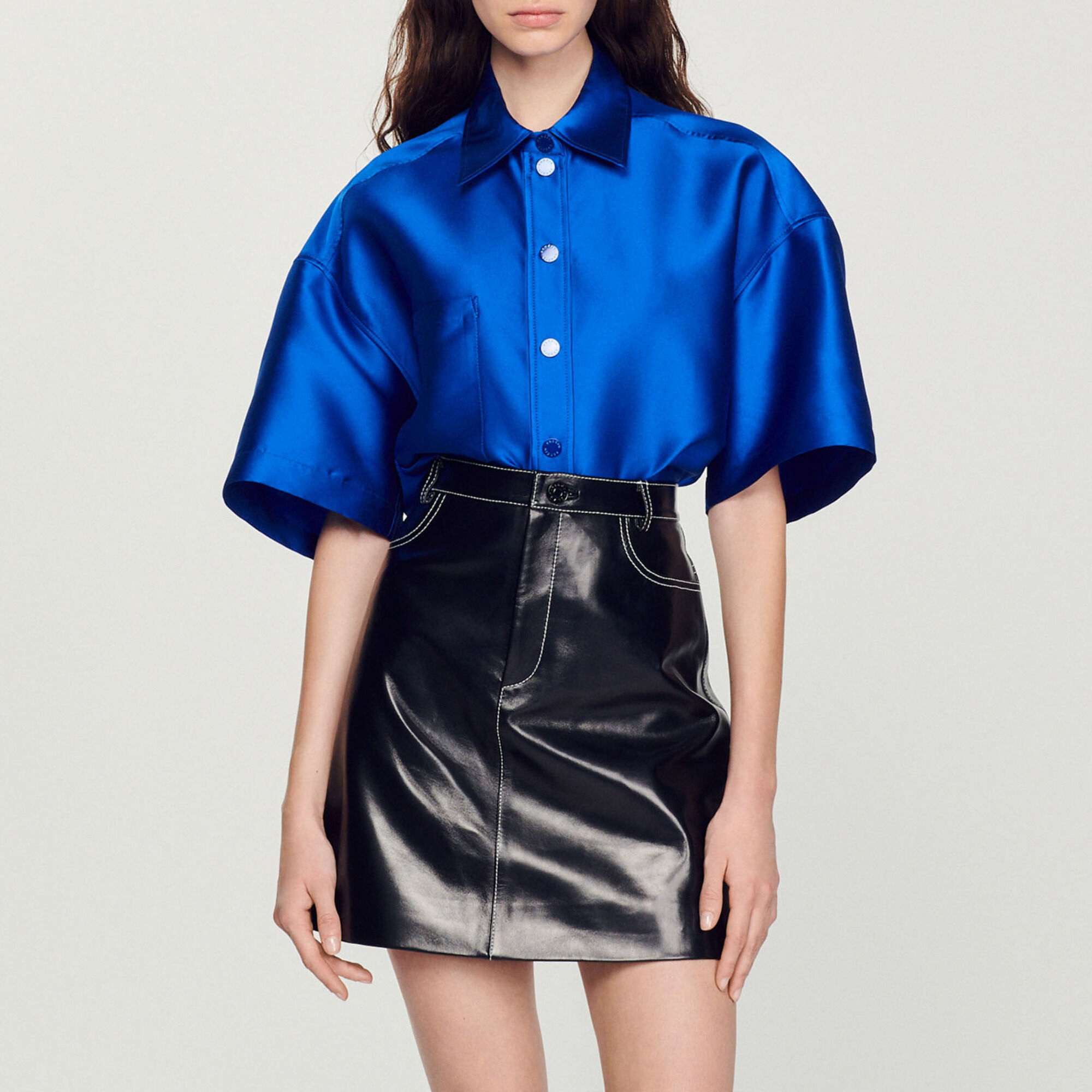 Short topstitched leather skirt