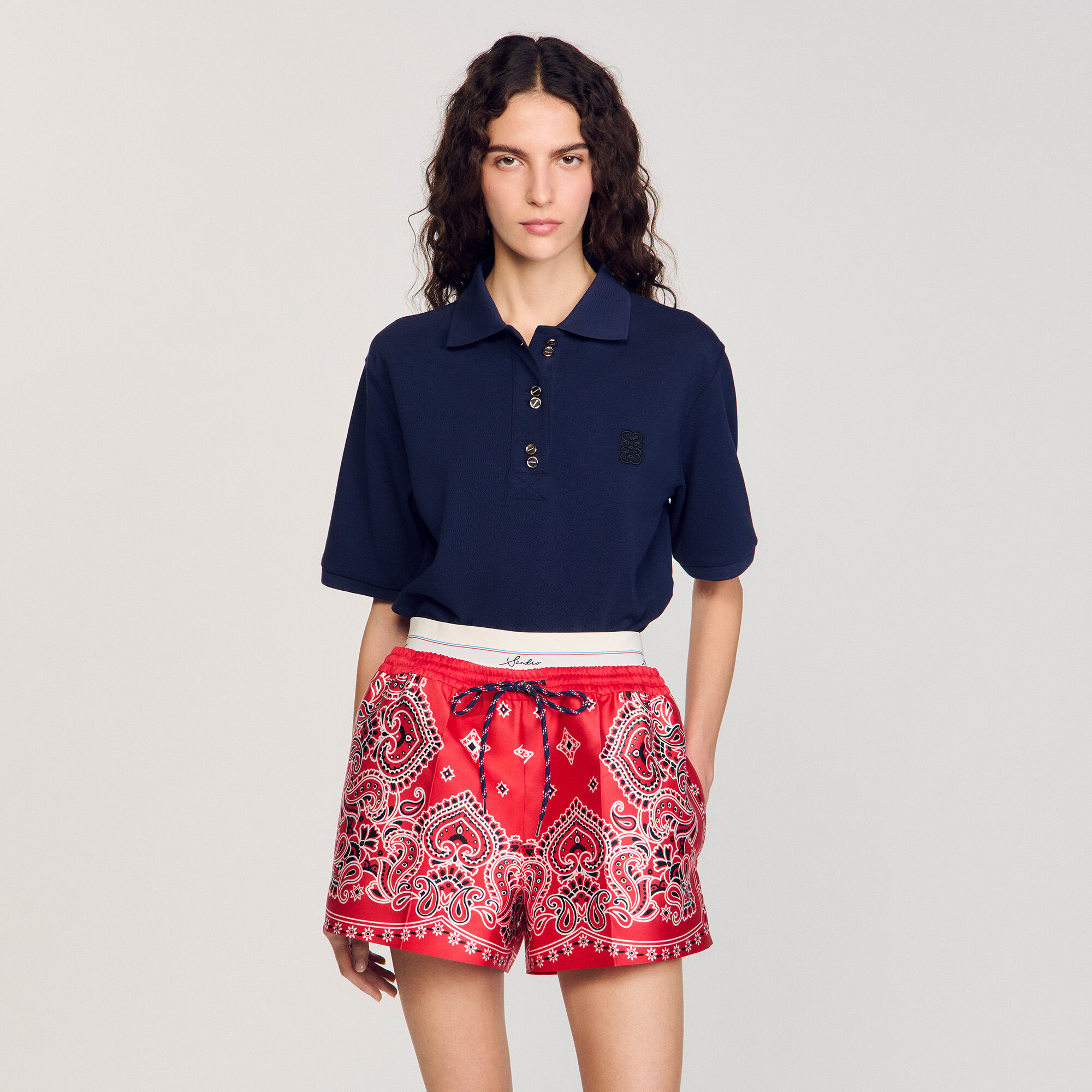 Polo shirt with decorative buttons
