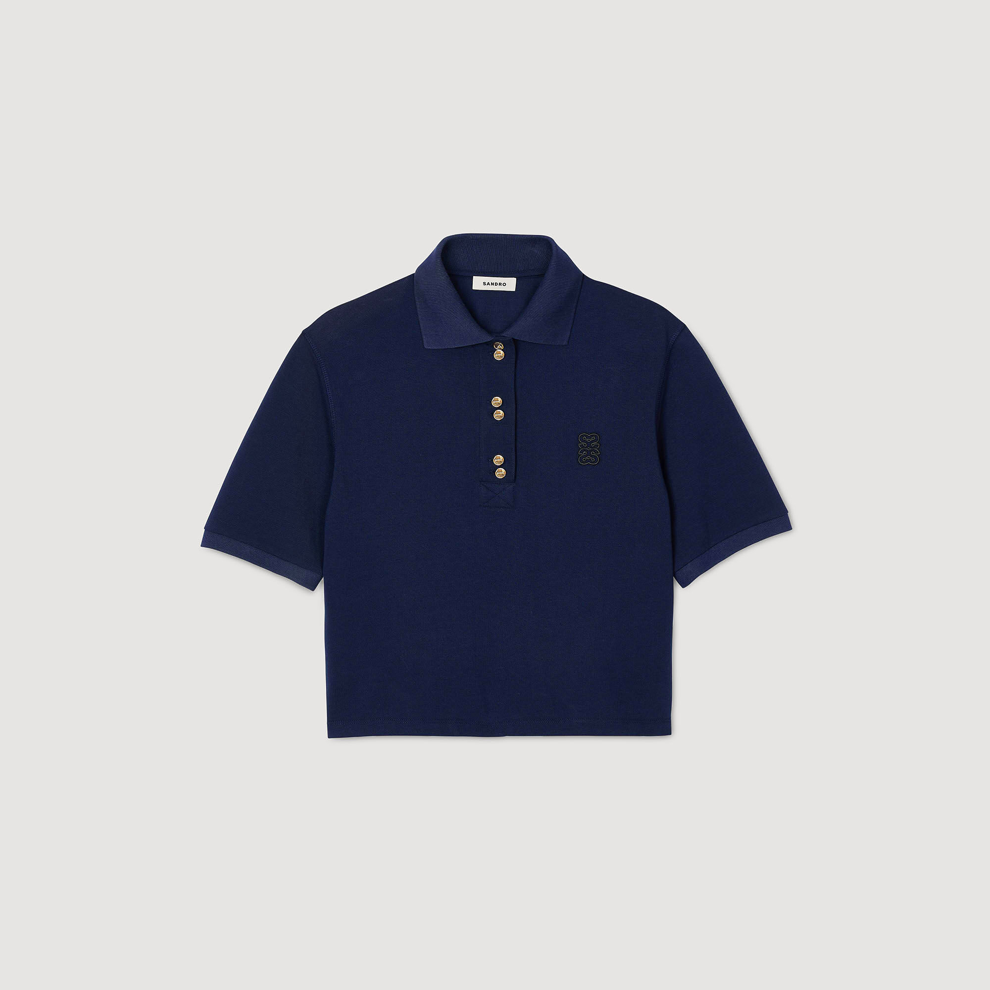 Polo shirt with decorative buttons