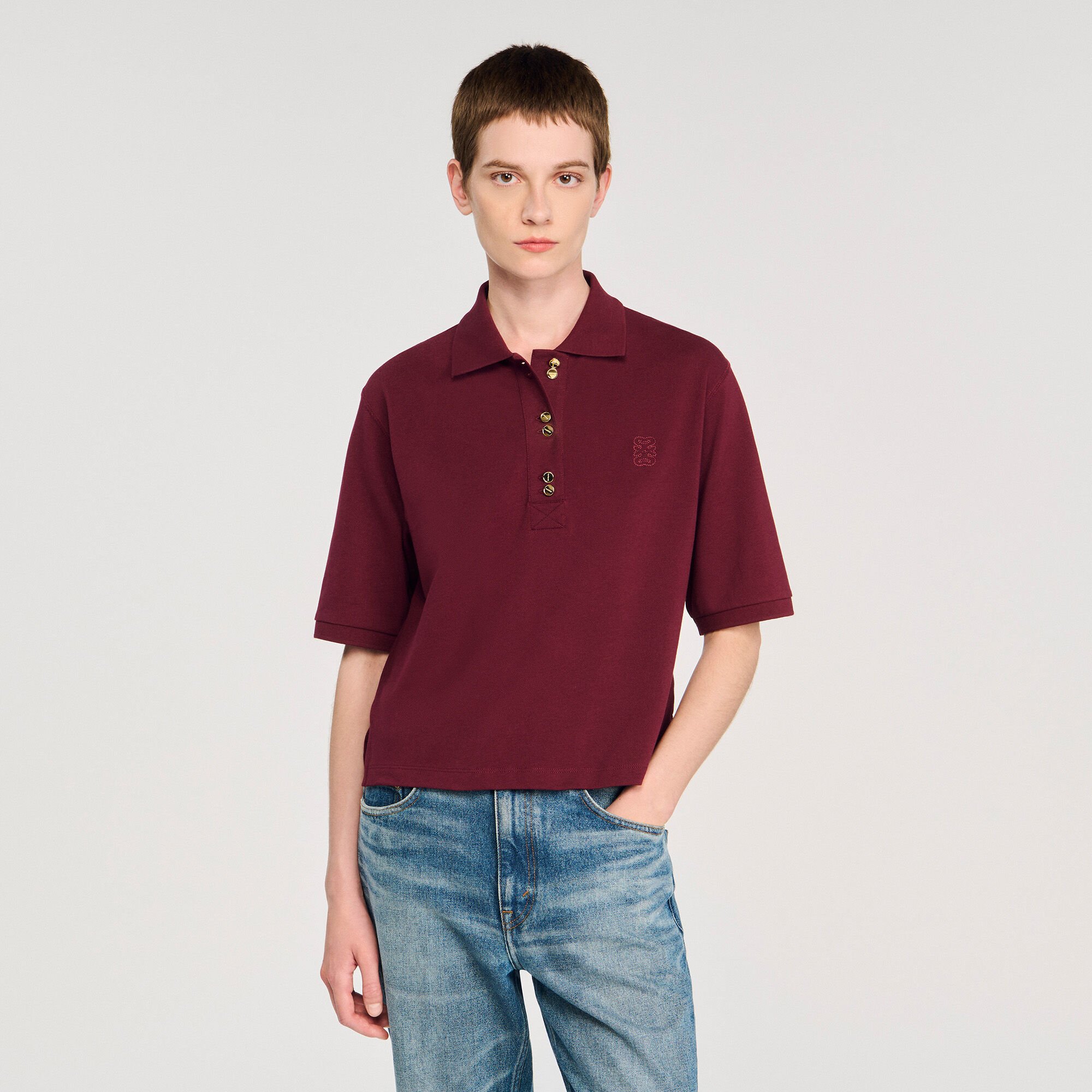 Polo shirt with decorative buttons