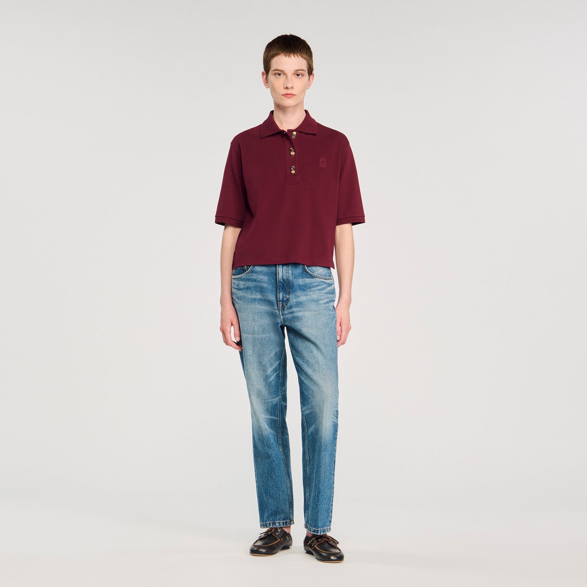 Polo shirt with decorative buttons