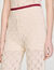 Crochet-look knit trousers