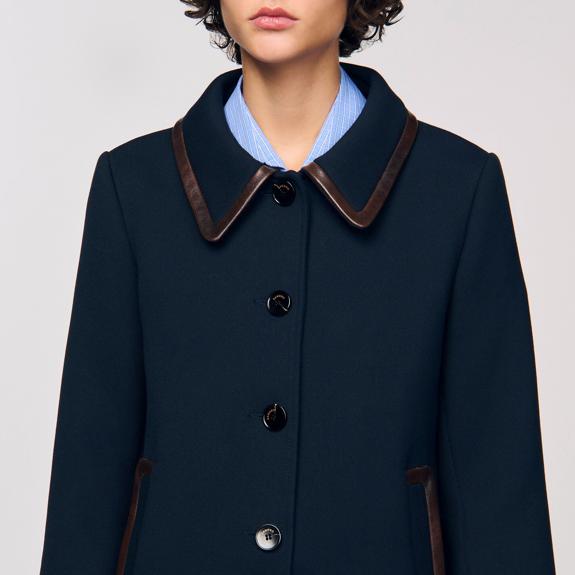 Coat with leather stripes