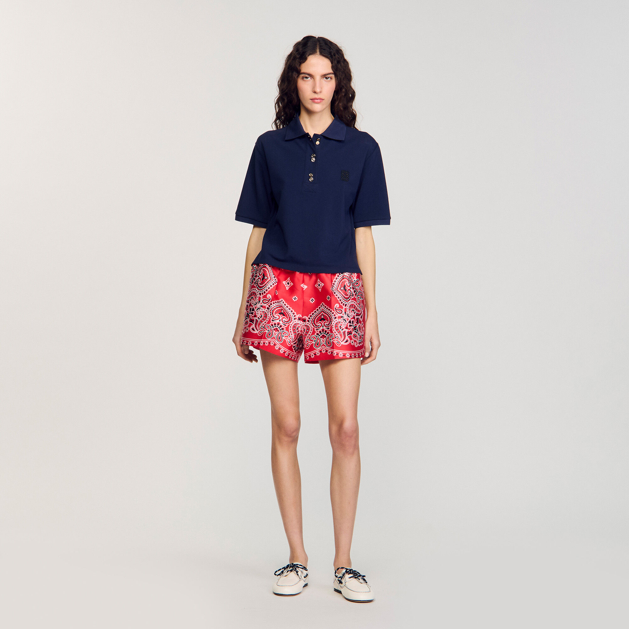 Polo shirt with decorative buttons