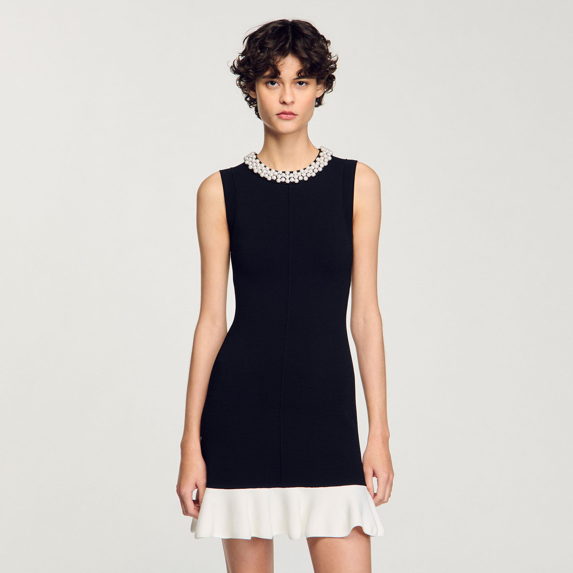 Short knit dress with beaded neck