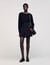 Short skirt with stitched pleats