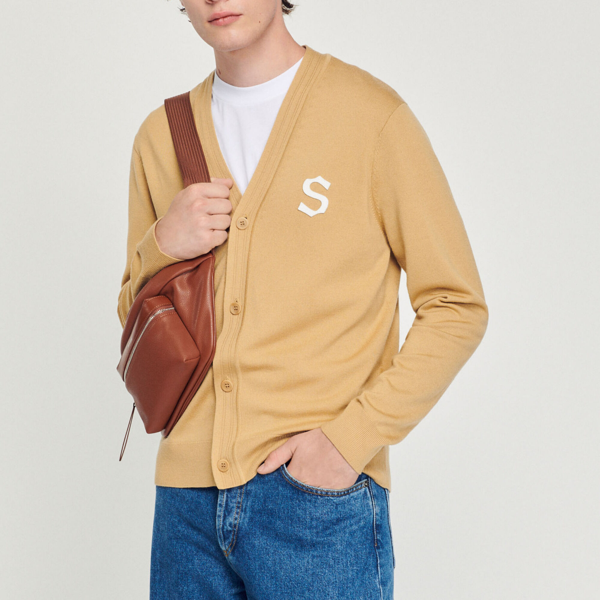 Wool cardigan with S patch