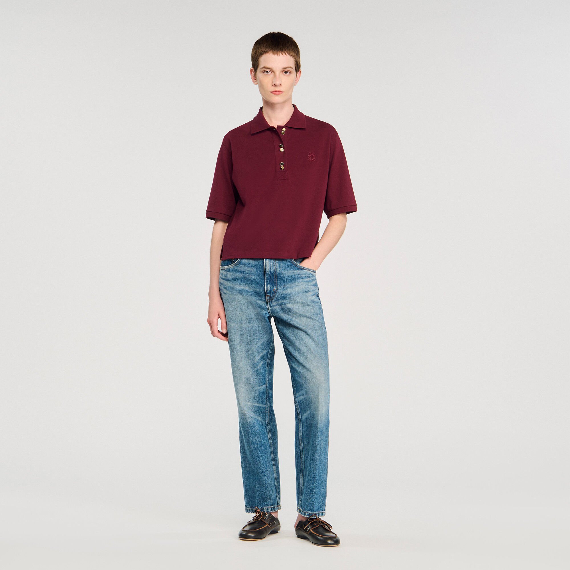 Polo shirt with decorative buttons
