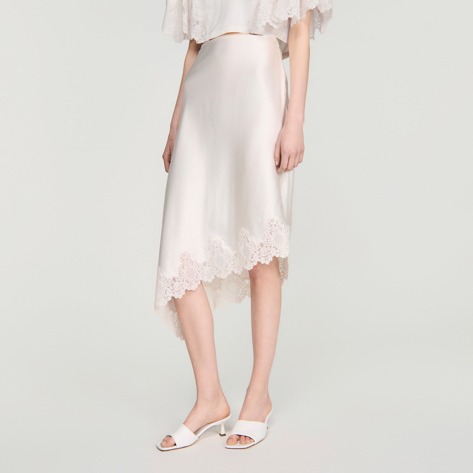Asymmetrical satin skirt with lace