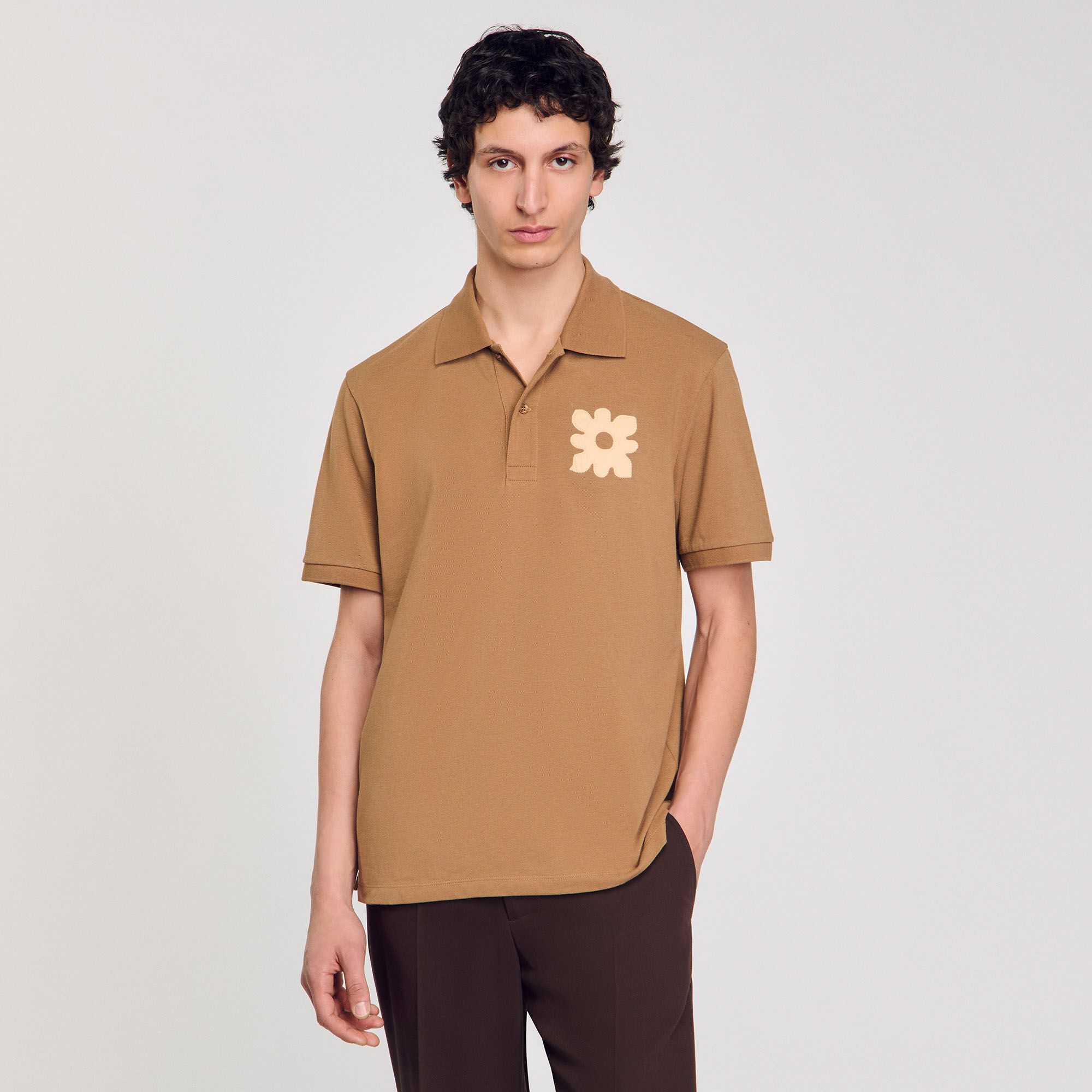 Polo shirt with flower patch