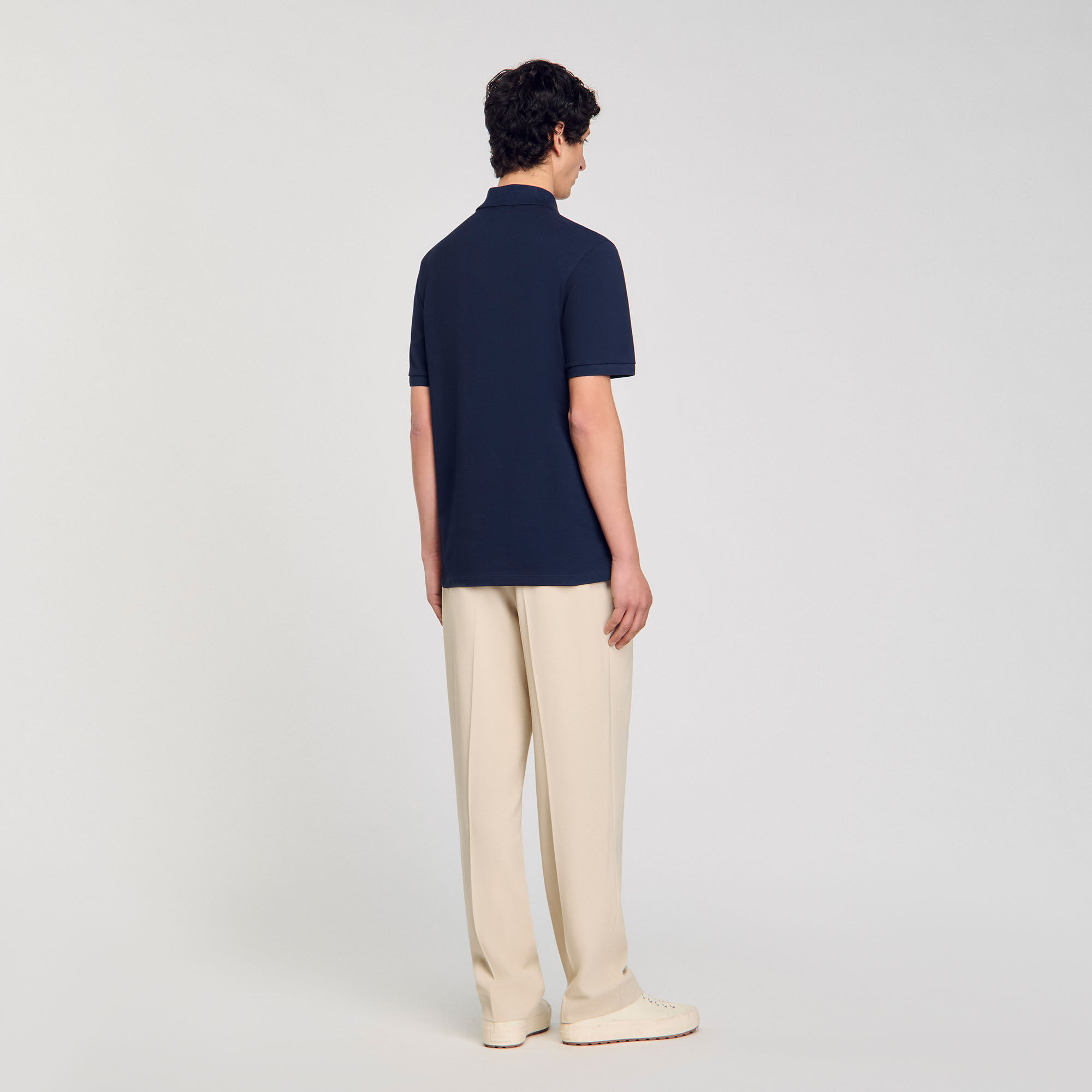 Polo shirt with flower patch