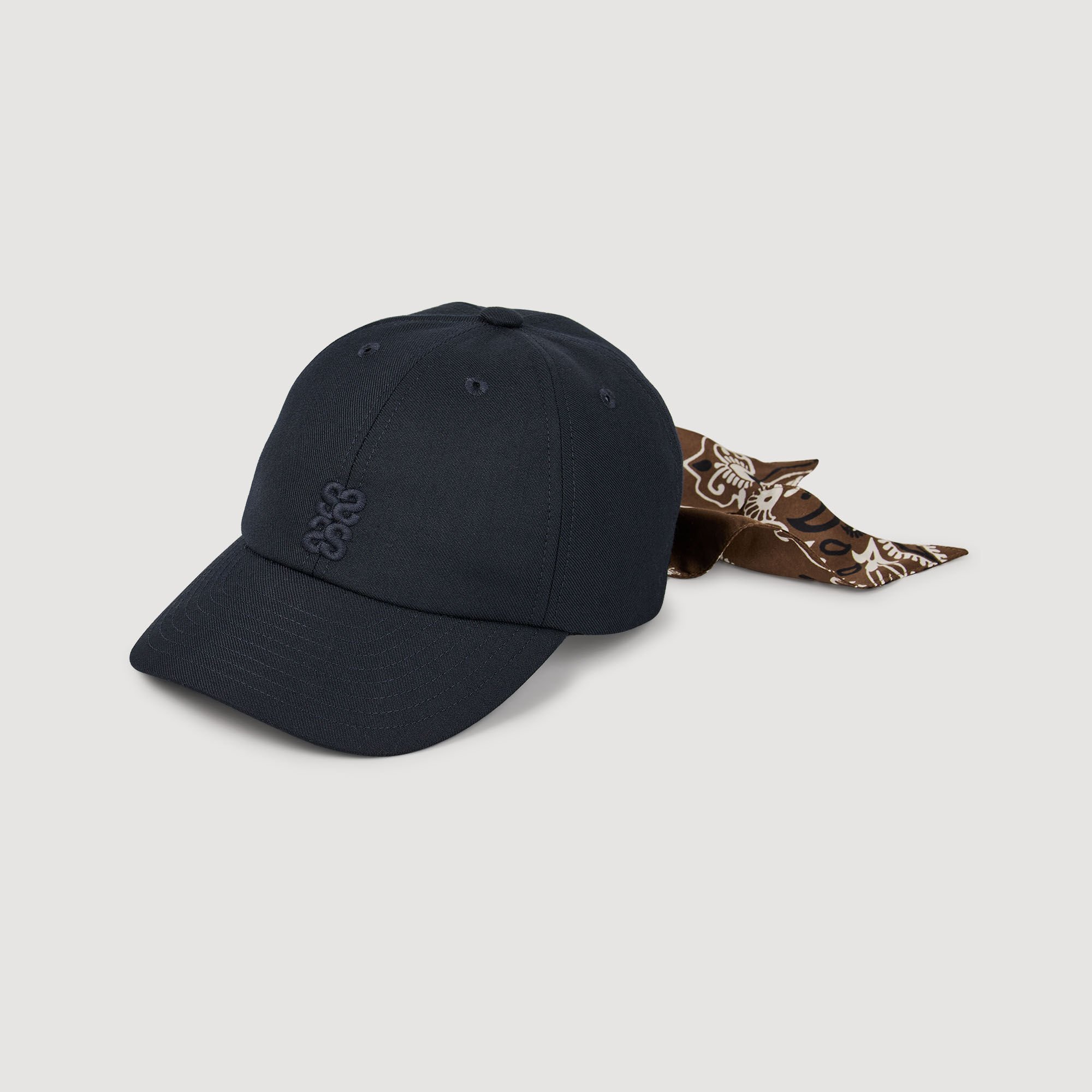 Cap with tied scarf