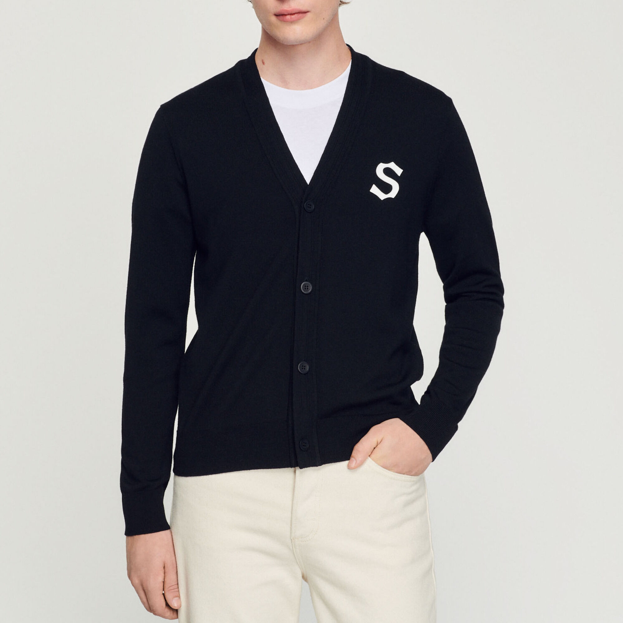 Wool cardigan with S patch