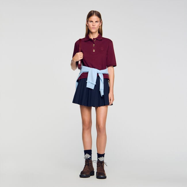 Polo shirt with decorative buttons