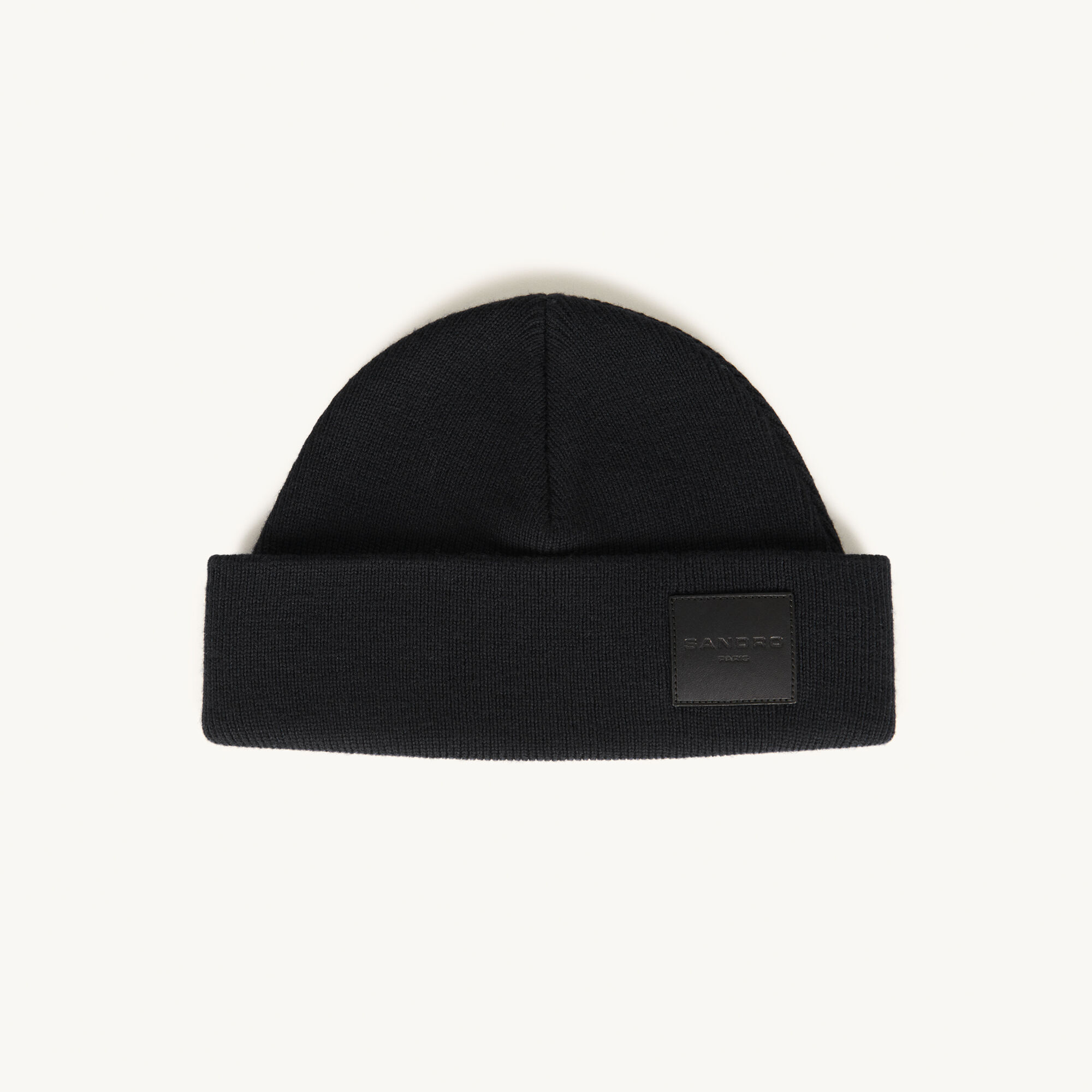 Woollen beanie with leather jacron label