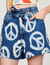 Wide denim shorts with peace motifs