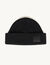 Woollen beanie with leather jacron label
