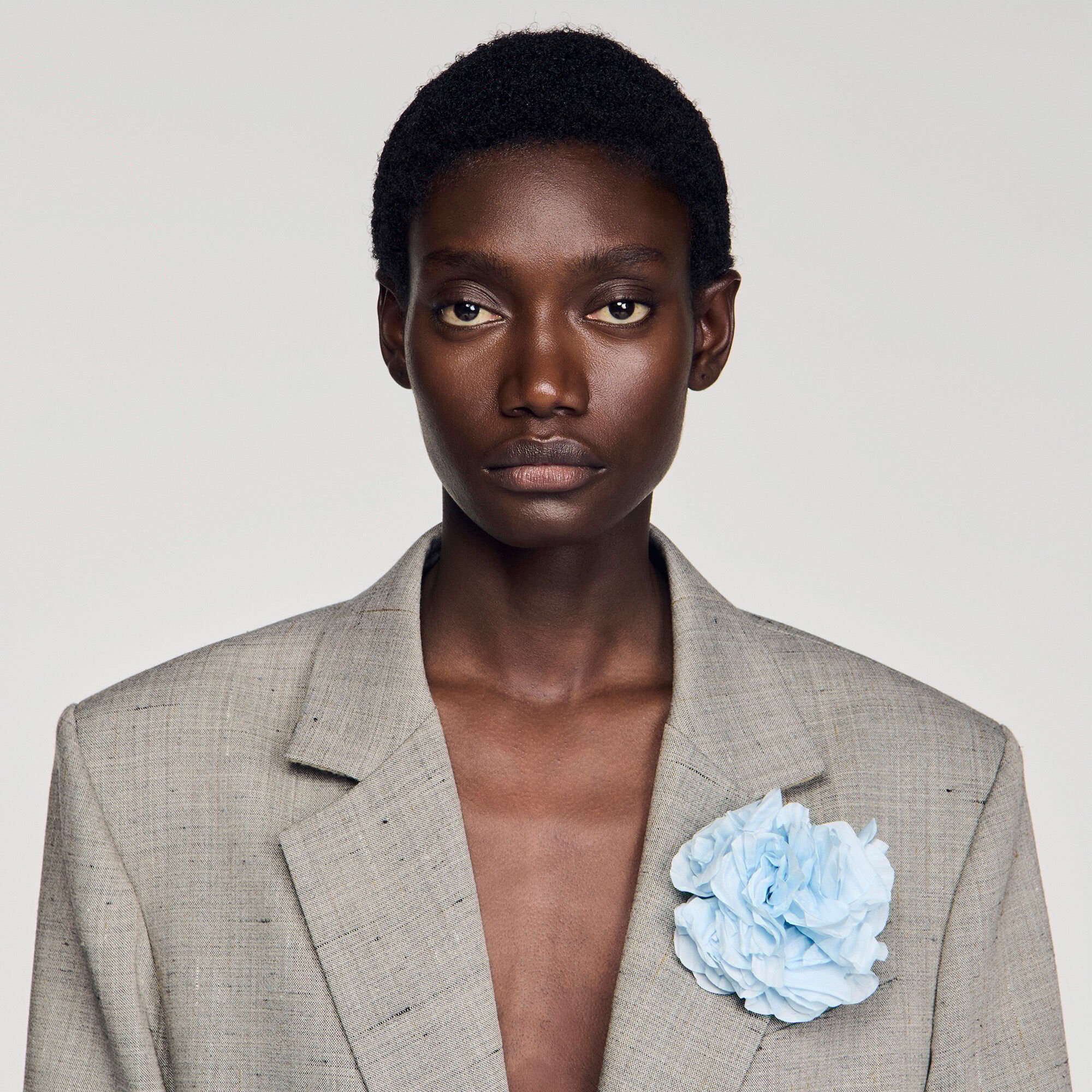 Checked wool jacket with brooch