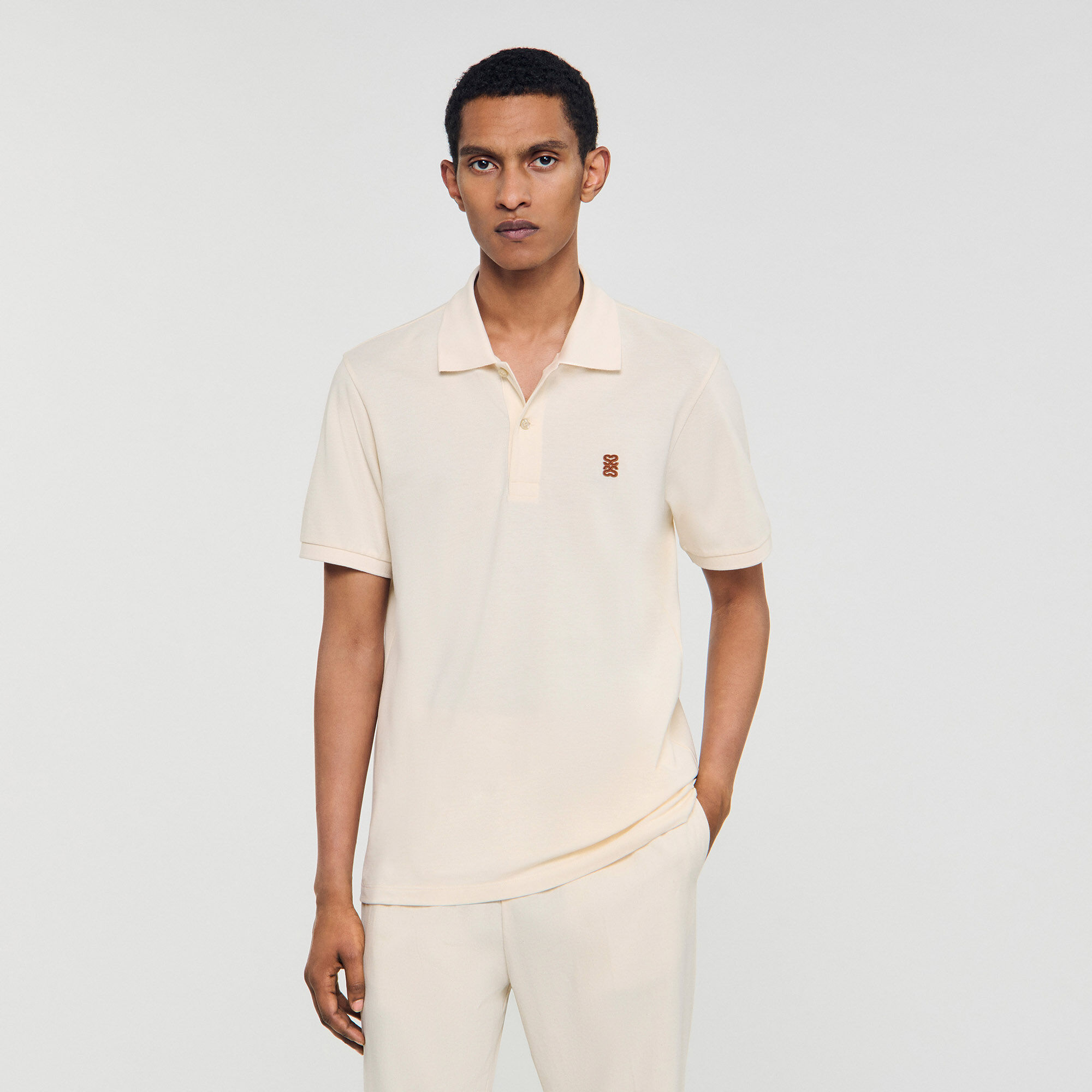Polo shirt with leather logo white / beige for Men | Sandro