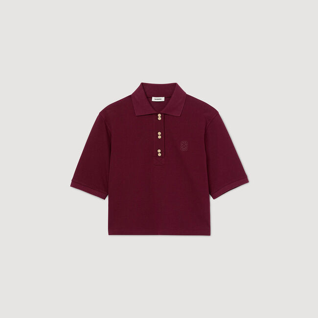 Polo shirt with decorative buttons